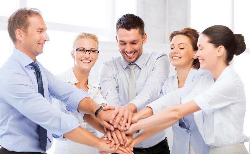 business team celebrating victory in office